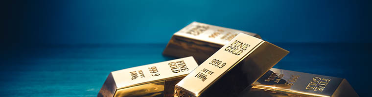 Złoto pod presją silnego dolara i rewizji oczekiwań wobec polityki Fed pomimo napięć geopolitycznych